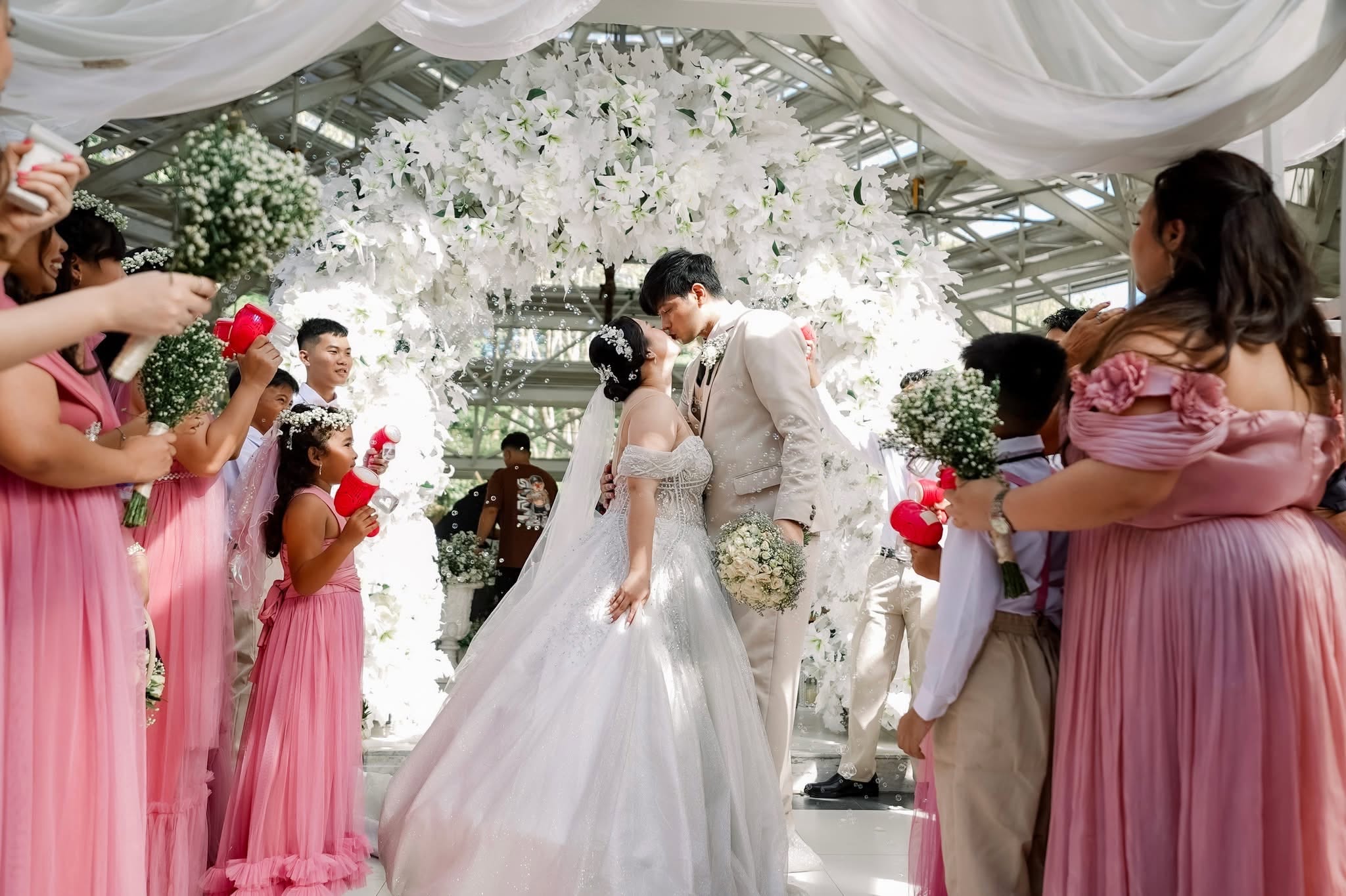 Bride and groom walking through a wedding aisle